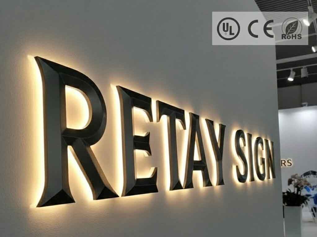 High-quality LED halo-lit dimensional letter sign 'RETAY SIGN' with UL, CE, and RoHS certification logos in the top-right corner.