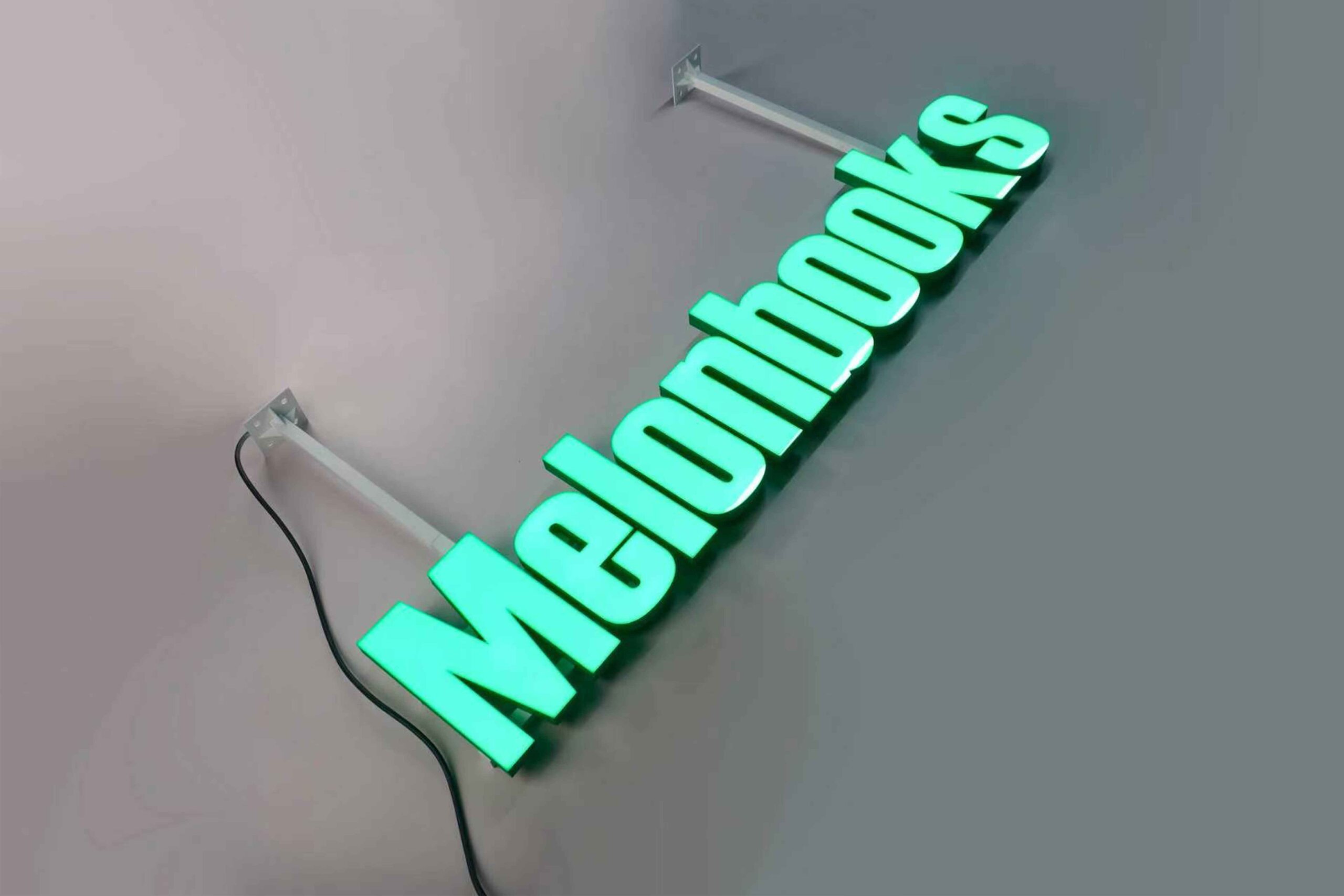  MAJI TREATS brand identity featuring front-lit trimless hanging letters with a silver stainless steel base, creating a premium modern indoor lighting effect.