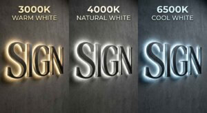 A comparison of custom halo-lit metal signs in three LED color temperatures: 3000K warm white, 4000K natural white, and 6500K cool white showing different lighting effects on a concrete wall.