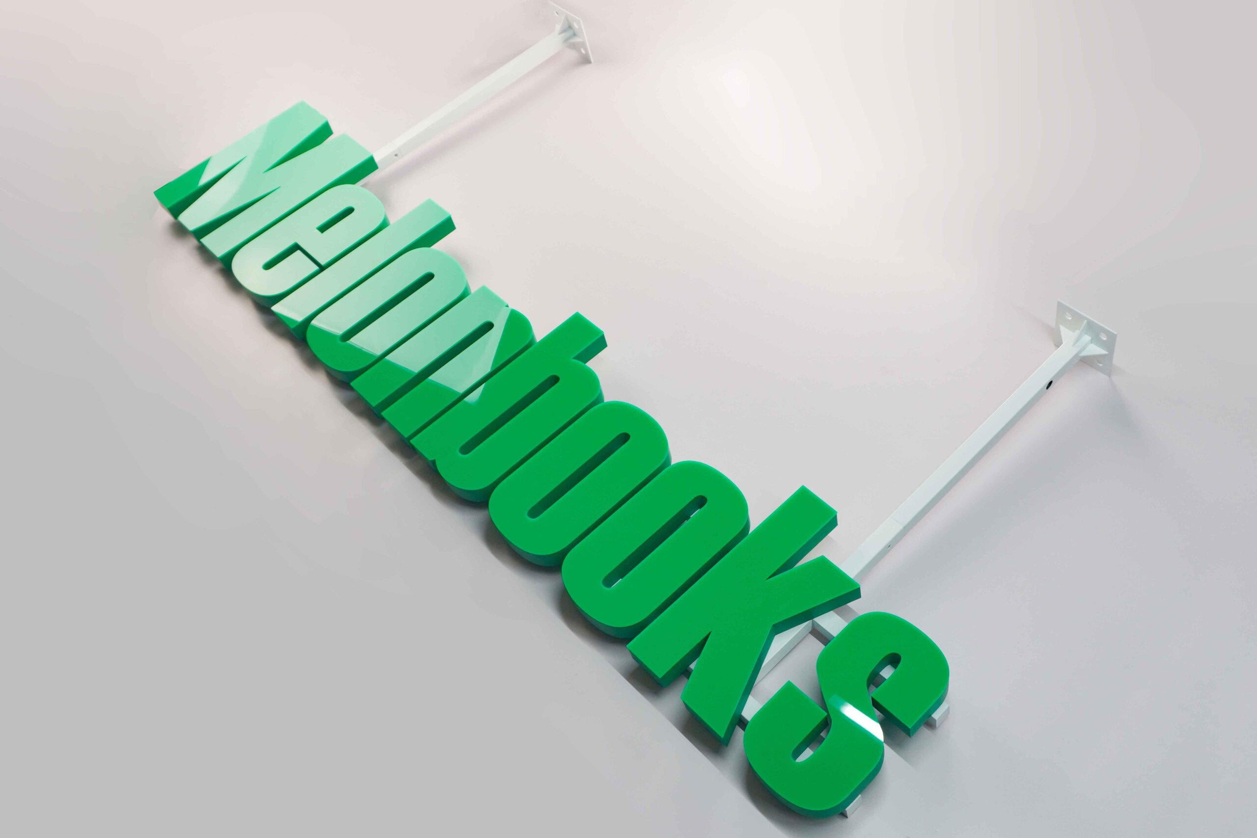  MAJI TREATS brand identity featuring front-lit trimless hanging letters with a silver stainless steel base, creating a premium modern indoor lighting effect.