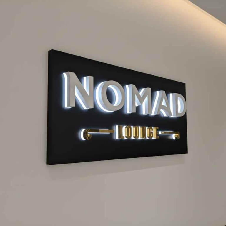 High-end 3D **custom led signs** featuring a minimalist black and gold aesthetic for luxury lounge branding.