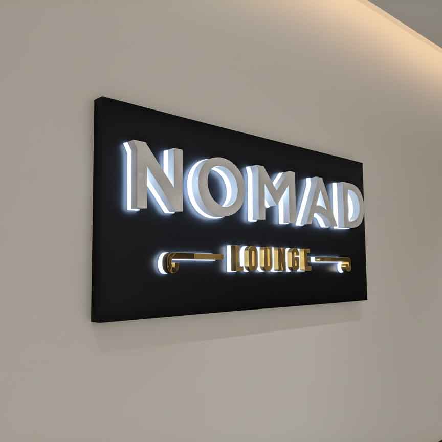 High-end 3D **custom led signs** featuring a minimalist black and gold aesthetic for luxury lounge branding.