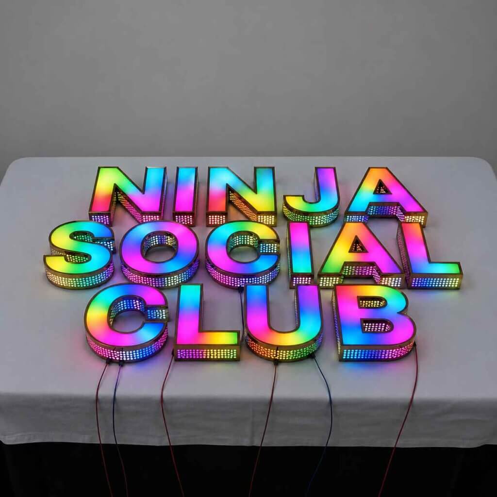 Custom premium RGB channel letters with programmable LED lighting for the Ninja Social Club storefront signage