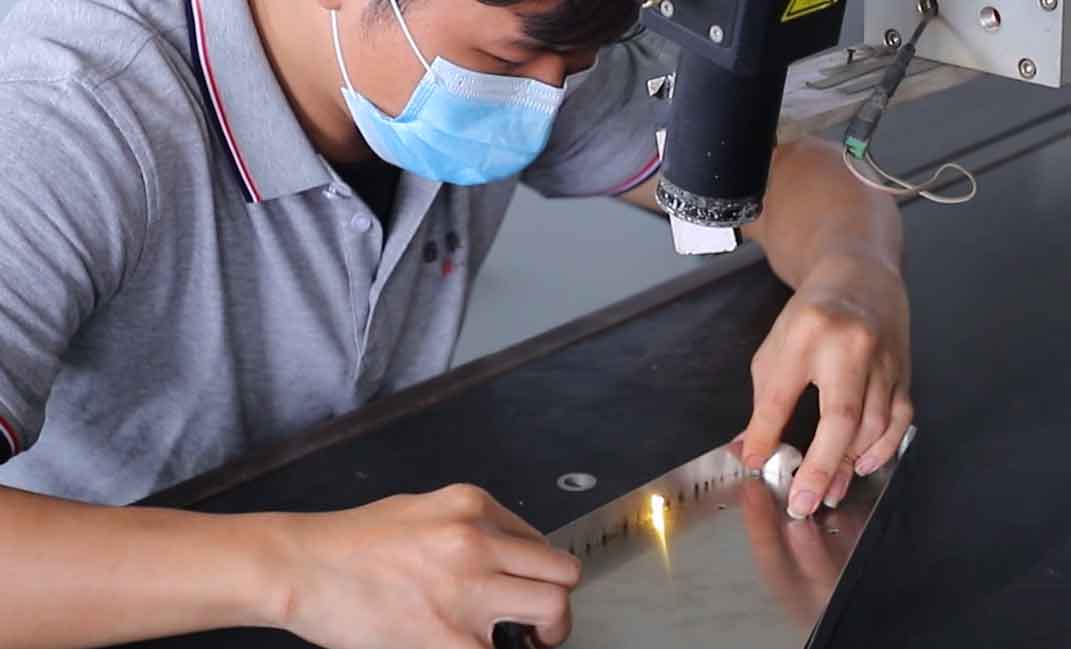 Detailed view of professional laser cutting services in a modern factory, showing precision metal fabrication and industrial manufacturing.