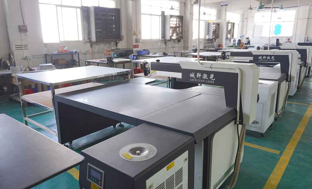Technicians use laser welding machines to securely join the letter shell and the panel.