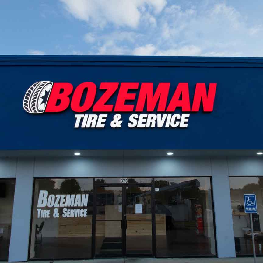 Round double-sided outdoor projecting light box for Saisons Restaurant, featuring custom printed logo and internal LED lighting.