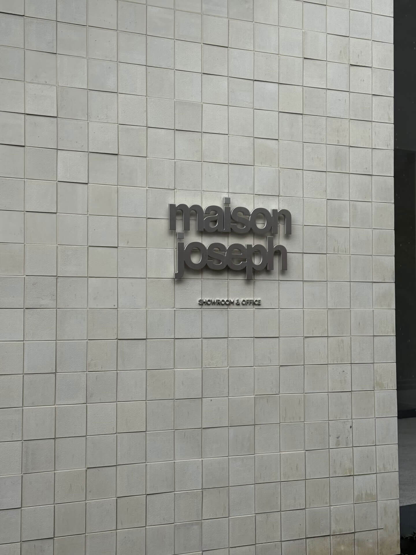 Custom outdoor projecting light box sign, featuring a minimalist and modern commercial design.