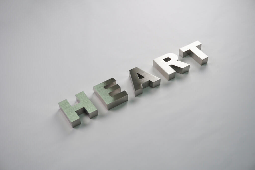 Precision-crafted brushed stainless steel 3D signage letters "HEART", highlighting professional metal fabrication quality.