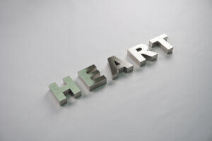 Precision-crafted brushed stainless steel 3D signage letters "HEART", highlighting professional metal fabrication quality.