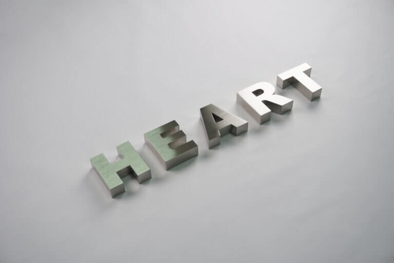 Precision-crafted brushed stainless steel 3D signage letters "HEART", highlighting professional metal fabrication quality.