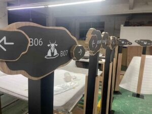 Directional wayfinding signs with cow icon and custom numbers
