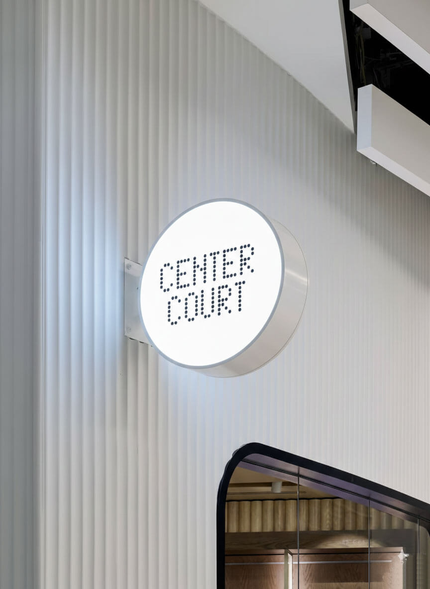 Custom outdoor projecting light box sign, featuring a minimalist and modern commercial design.
