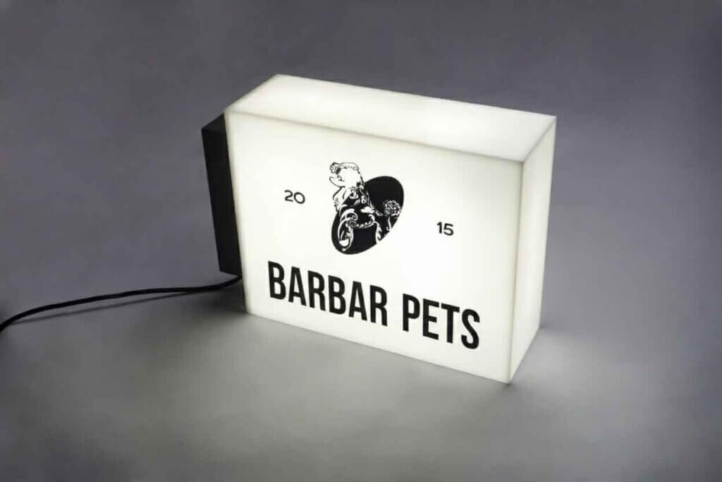 Side view of an illuminated rectangular acrylic box sign with high-brightness LED modules.