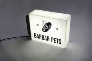 Side view of an illuminated rectangular acrylic box sign with high-brightness LED modules.