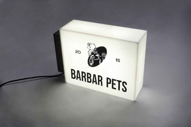 Side view of an illuminated rectangular acrylic box sign with high-brightness LED modules.