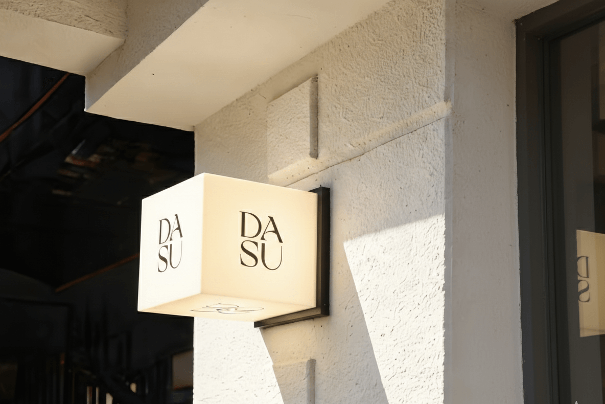 Custom outdoor projecting light box sign, featuring a minimalist and modern commercial design.