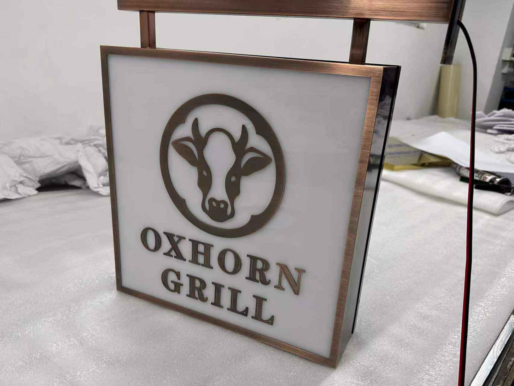 Side view of an illuminated rectangular acrylic box sign with high-brightness LED modules.