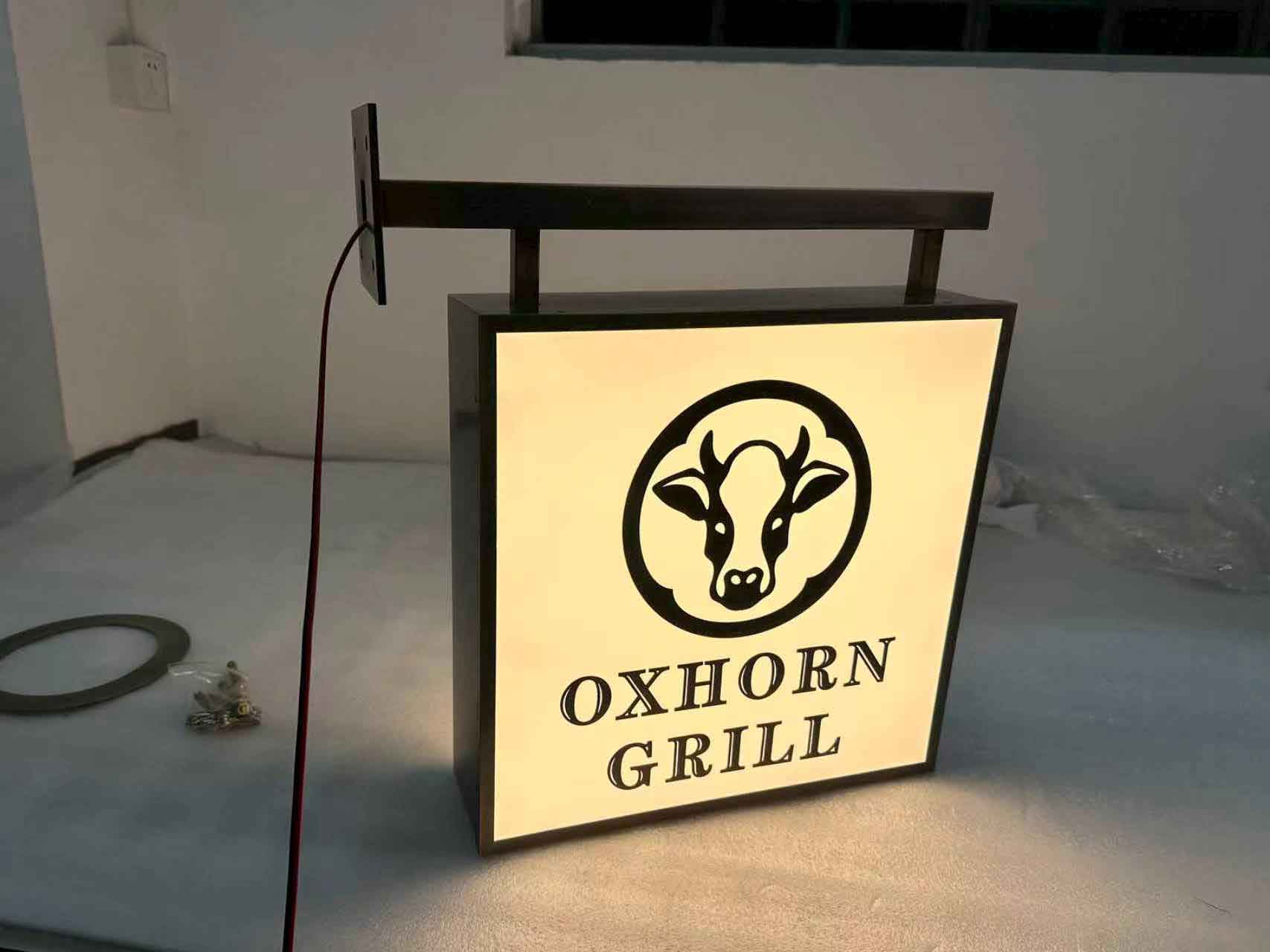 Side view of an illuminated rectangular acrylic box sign with high-brightness LED modules.