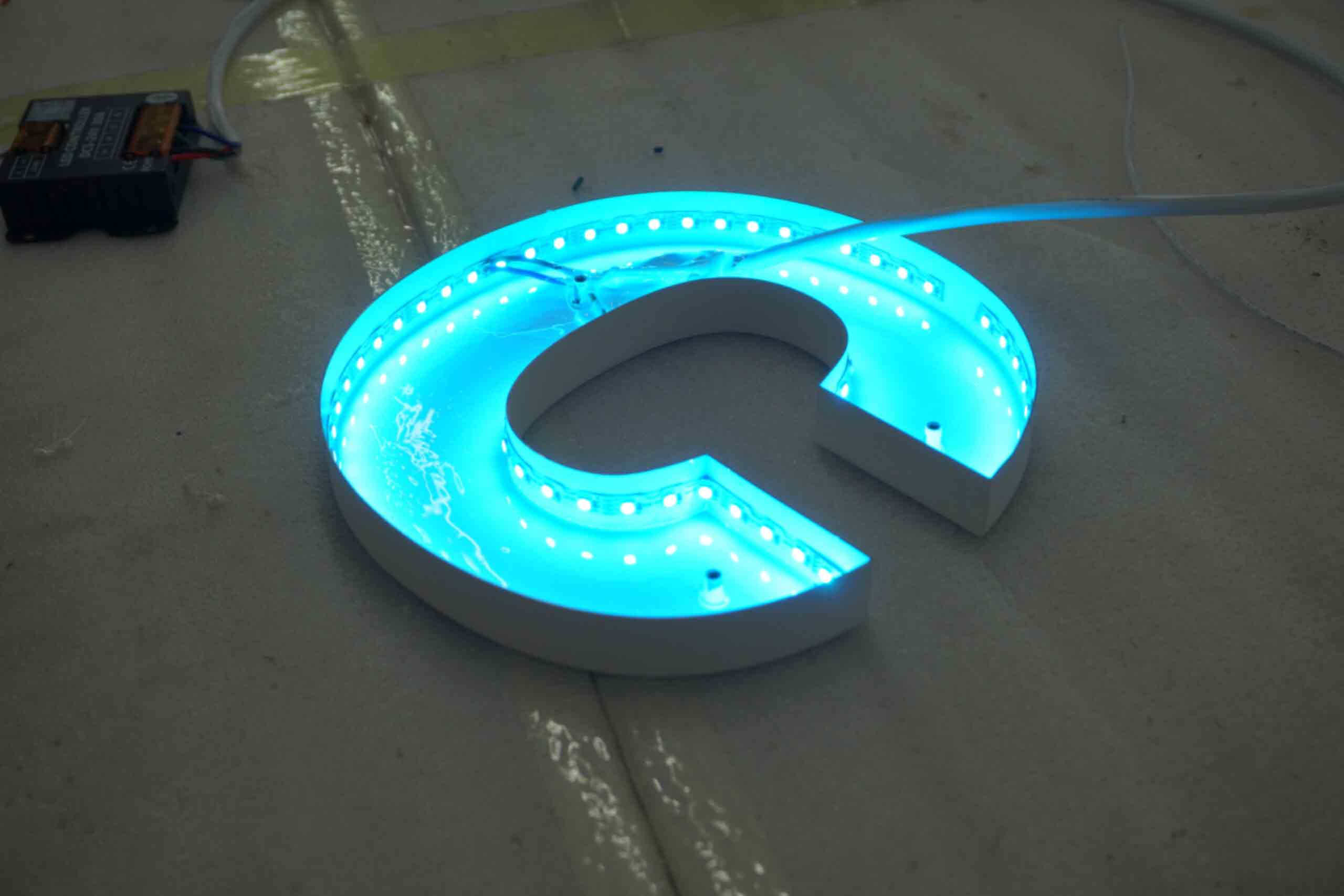 Resources 6 Round double-sided outdoor projecting light box for Saisons Restaurant, featuring custom printed logo and internal LED lighting.