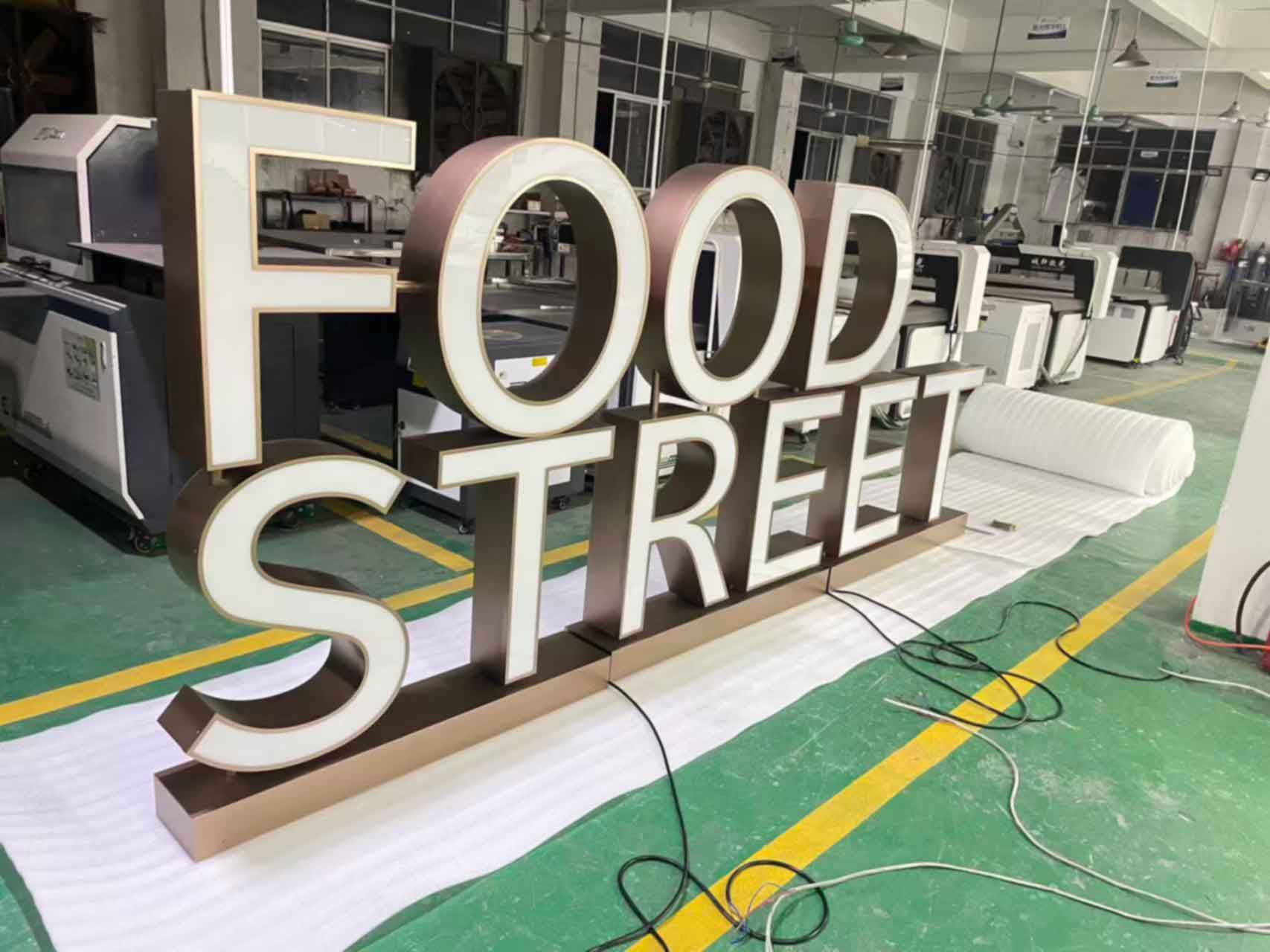 Illuminated Front Lit Channel Letters installed on a retail store facade.