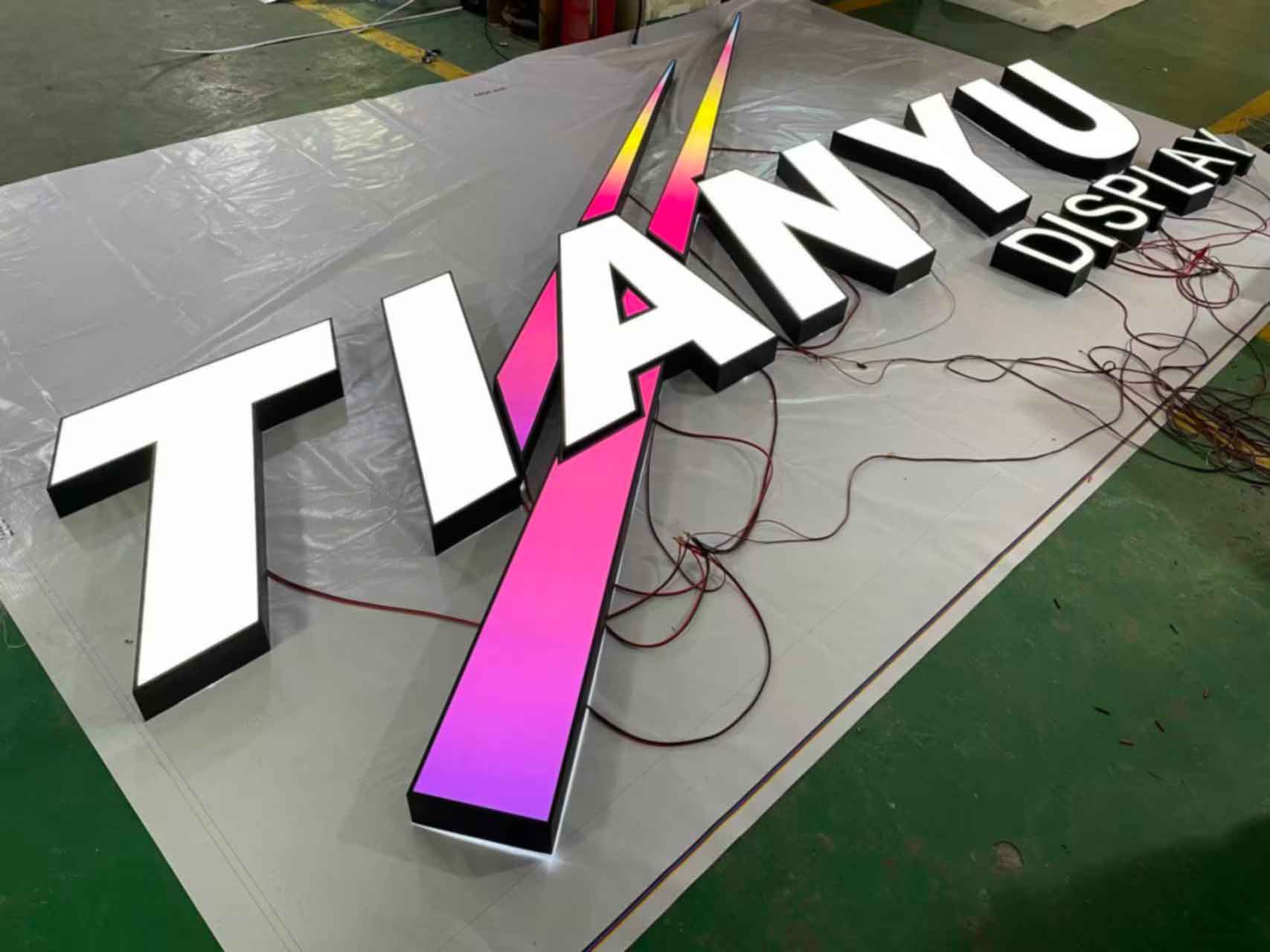 Premium stainless steel Front Lit Channel Letters for commercial building signage.