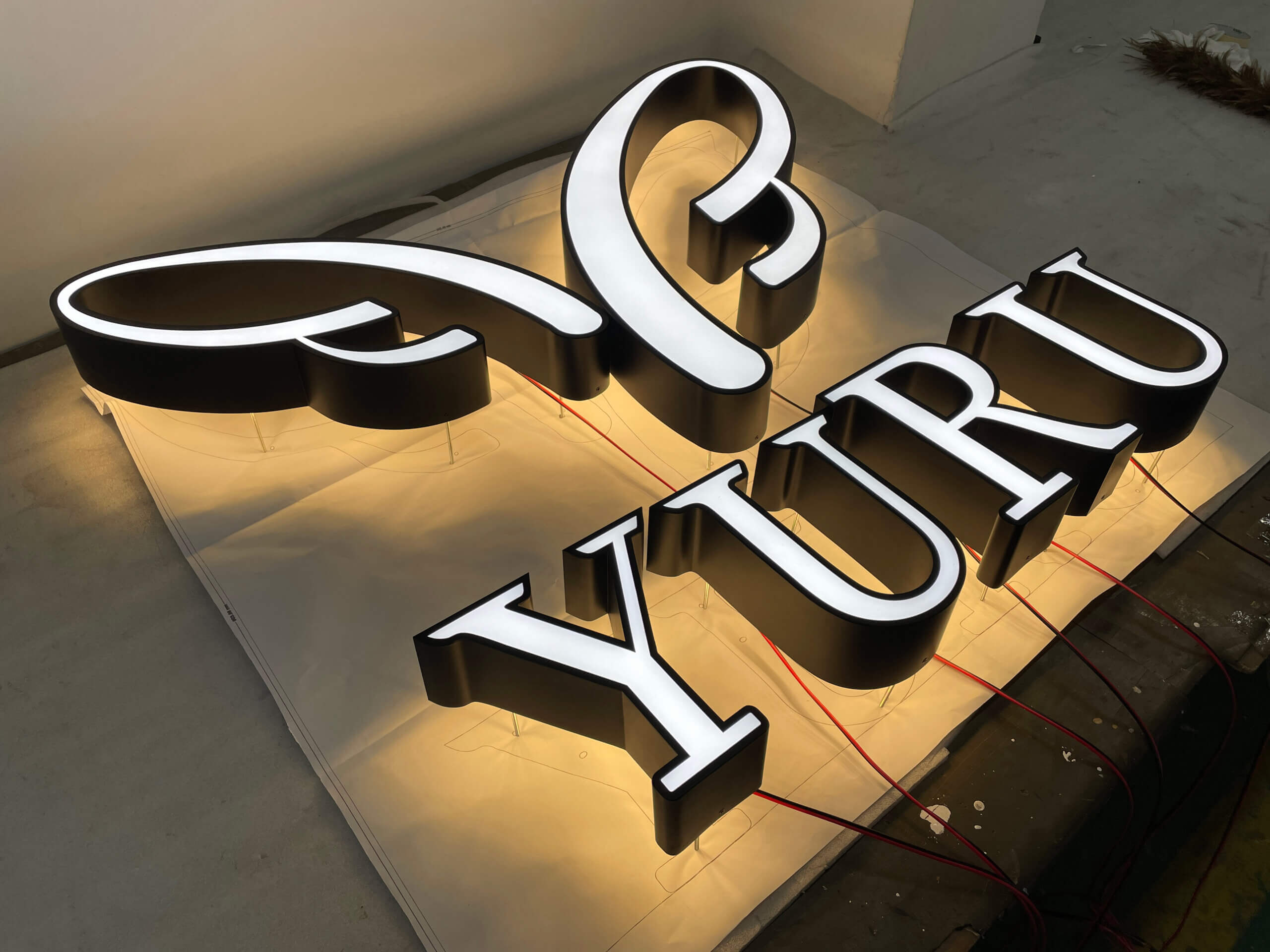 Commercial Front Lit Channel Letters custom fabricated for hotel signage.